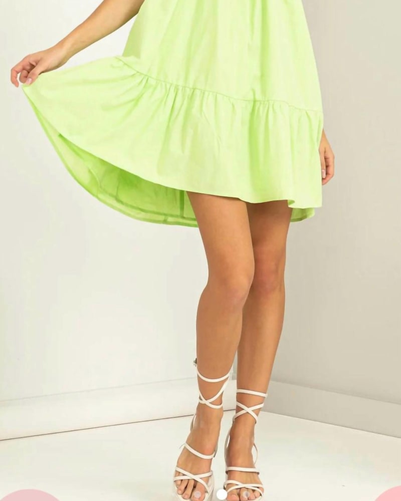 Front of a model wearing a size Large Sleeveless Ruffled Mini Dress In Chartreuse in Chartreuse by HYFVE. | dia_product_style_image_id:344676